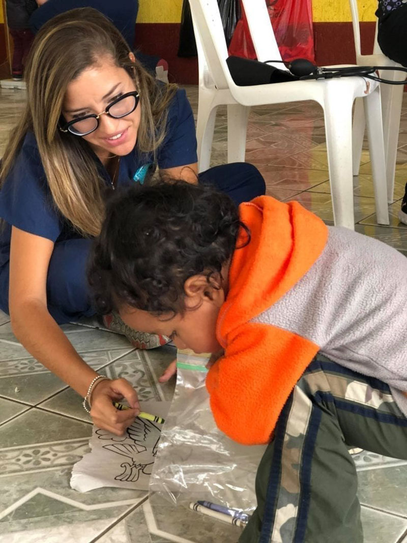 Med4You member Ariana Hernandez playing with one of the pediatric patients from Santa Lucia Milpas Altas, Guatemala. Photo: UMHS Med4You