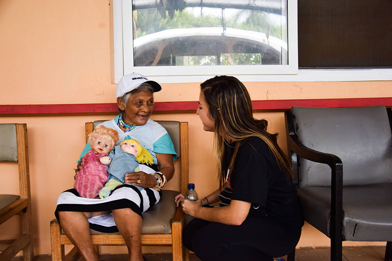 Ariana Hernandez (left, UMHS student & Med4You President) spending time with an elderly woman from a disadvantaged community in Guatemala. Photo: UMHS Med4You