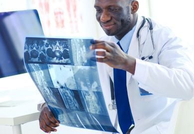 Black-surgeon-looking-at-scans