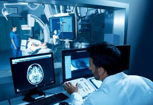 CT-scan-being-looked-at-by-interventional-radiologist