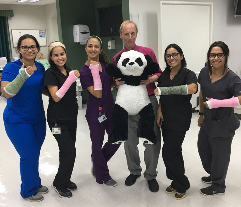 Dr. Michael Doherty (center) with UMHS students during a recent casting clinic. (Left to right): Tania Torres, Astrid Melendez Perez, Paola Mora Marrero, Paola Reyes-Torres. Photo: Dr. Michael Doherty.