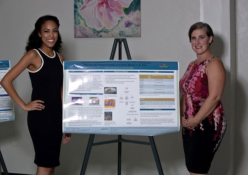 Christina Varela (left) & Dr. Jane Harrington. Christina gave a poster presentation on 'Detection of Salmonella & E.coli contamination from imported & domestically produced poultry from retail markets in St. Kitts'. © Ian Holyoak Photography