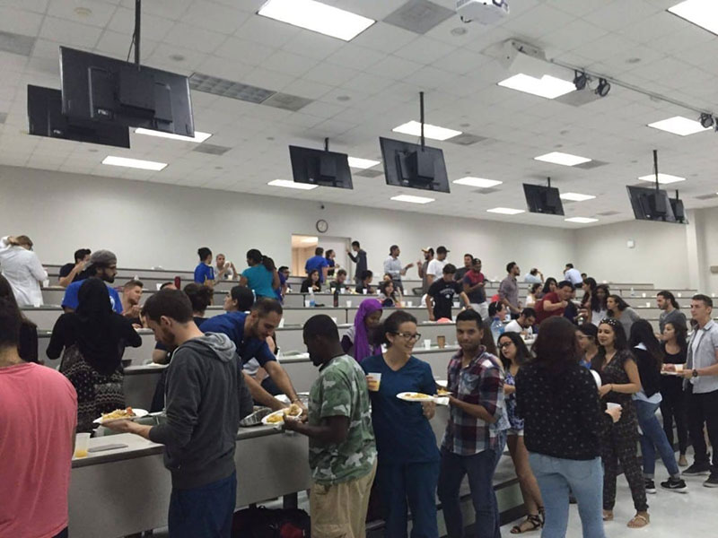 DINNER'S SERVED! UMHS students get food served during the event. Photo: Courtesy of UMHS MSA