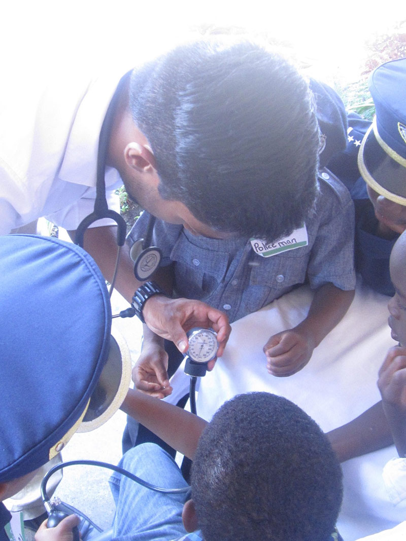 DOCTOR BASICS 101: Andrew Victor (pictured), Ludny Charles & Chyanne M. Brown taught the kids how to introduce themselves to a patient & calculate a pulse. Photo: Ludny Charles