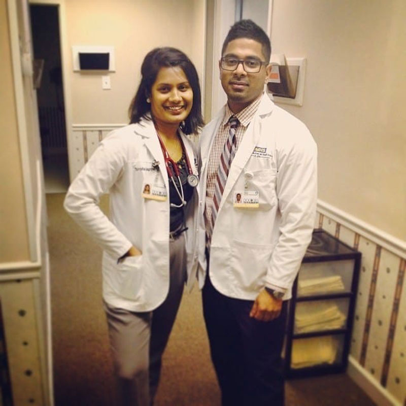 DR. RAJAGOPAL & DR. PATHMALINGAM: 'After USMLE Step 1 & beginning of first clinical rotation. This is Family Medicine outpatient clinic of Dr. Henderson, the woman who inspired me to become a Family Medicine doctor. Augusta, GA.' Photo: Courtesy of Dr. Thivisa Rajagopal