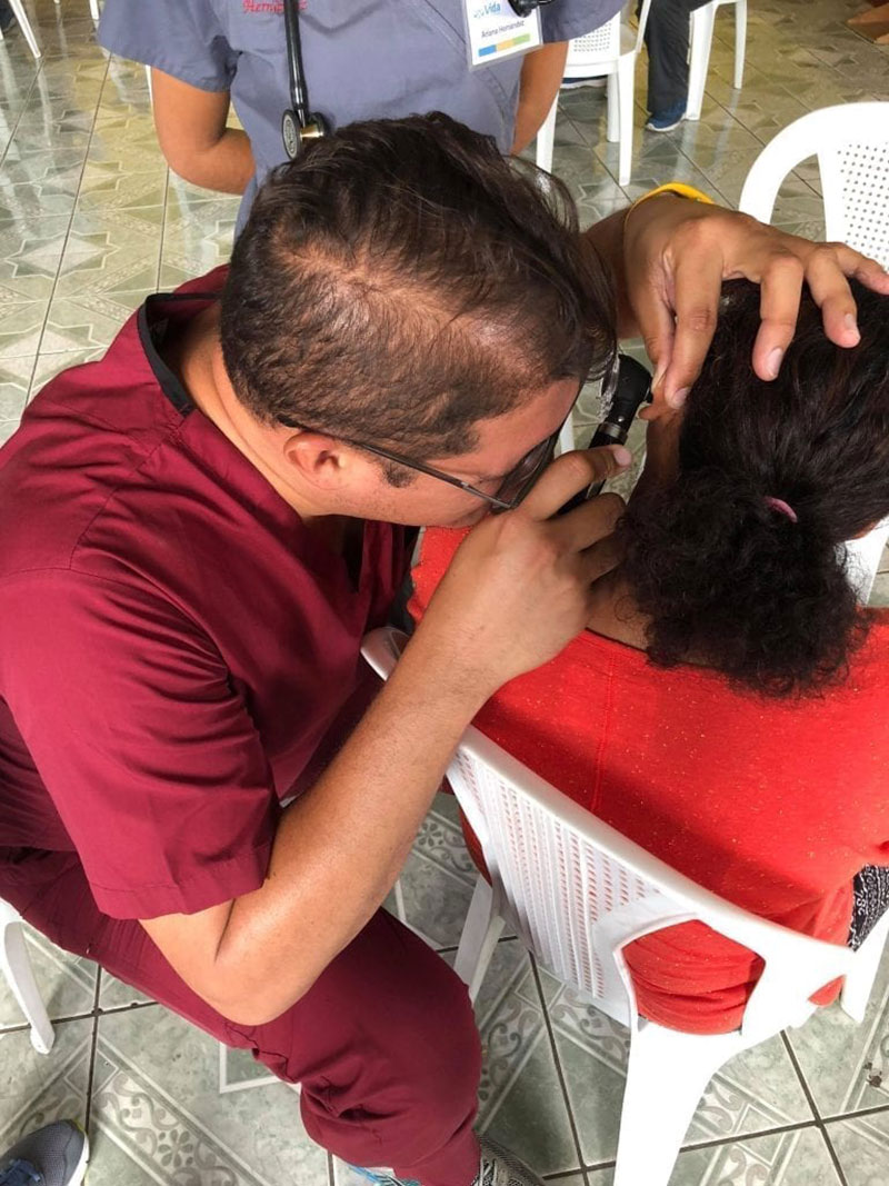 Dr. Angel Matos doing an ear examination in a patient from Santa Lucia Milpas Altas, Guatemala. Photo: UMHS Med4You