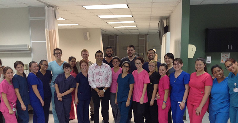 DR. KUMAR & UMHS STUDENTS: Dr. Kumar (center, white & pink shirt) with students during the Breast Examination Workshop. Photo: Courtesy of UMHS AMWA