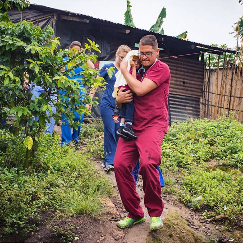 Dr. Angel Matos rescues a child suffering from malnutrition in a remote mountain area of Guatemala. Photo: UMHS Med4You