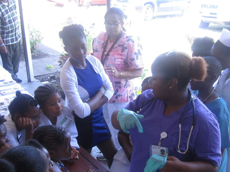 FUTURE DOCTOR INSPIRES THE KIDS: UMHS student Chyanne M. Brown teaches the kids about the important daily duties of a doctor. Photo: Ludny Charles.