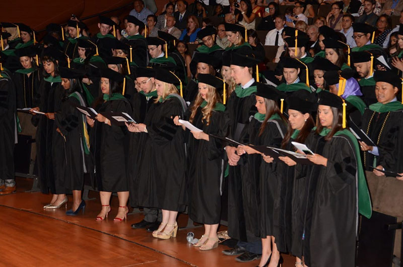 GRADUATES RECITING THE HIPPOCRATIC OATH: Doctors at last! Photo: Island Photography