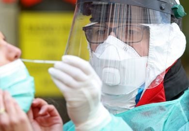 ID-specialist-doing-nasal-swab