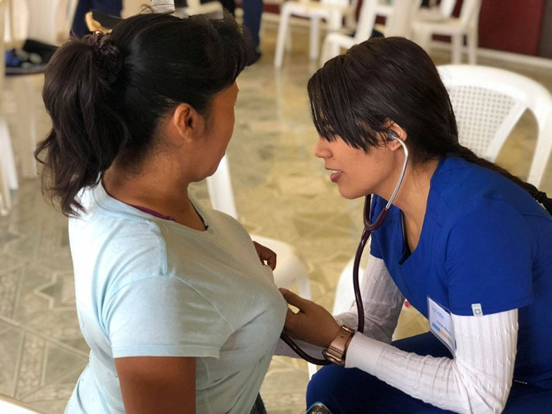 Med4You member Karen Nieves (right) doing a cardiac examination in Santa Lucia Milpas Altas community in Guatemala. Photo: UMHS Med4You