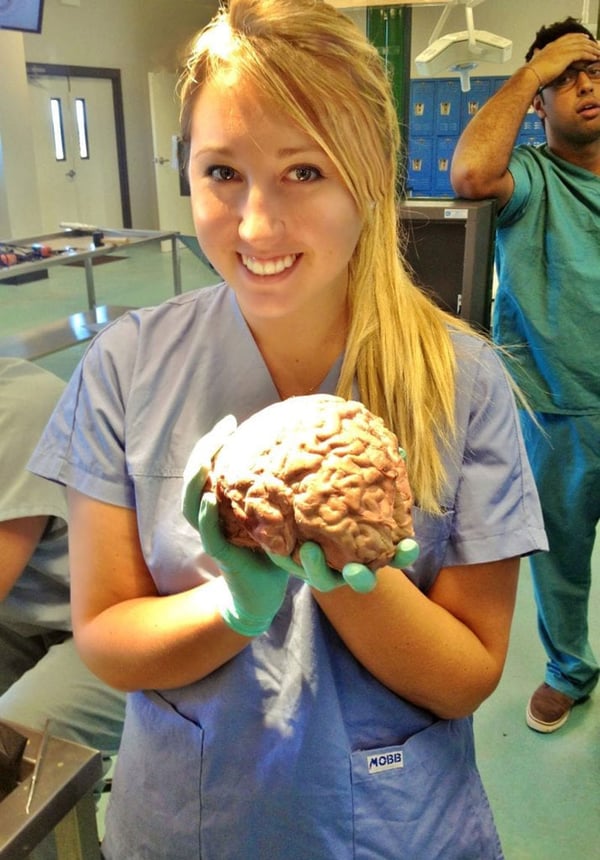 LEARNING IN LAB: Kirsten Fill learning about craniotomy & lobotomy in a cadaver dissection lab at UMHS in St. Kitts. Photo: Courtesy of Dr. Kirsten Fill