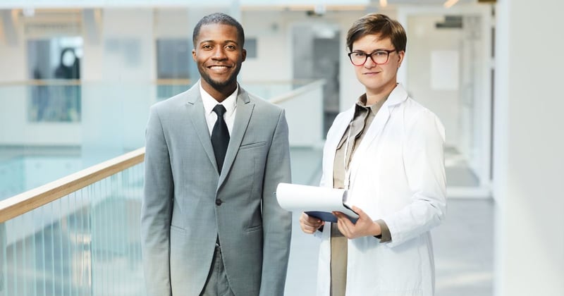 MD and PhD talking in a hospital