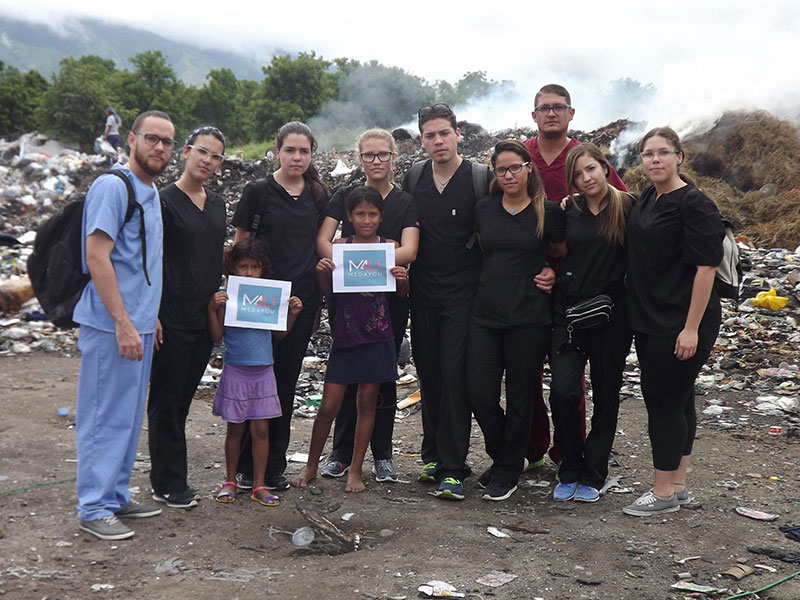 Med4You UMHS team & local children visiting 'The Dump,' where many Guatemalan citizens work. Photo: UMHS Med4You