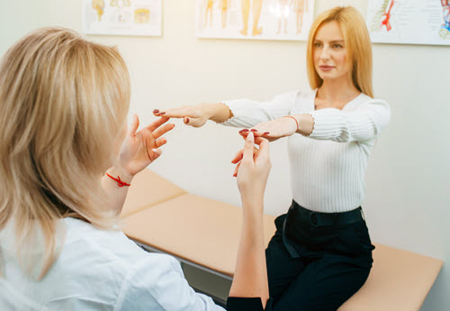 Neurologists testing female patient
