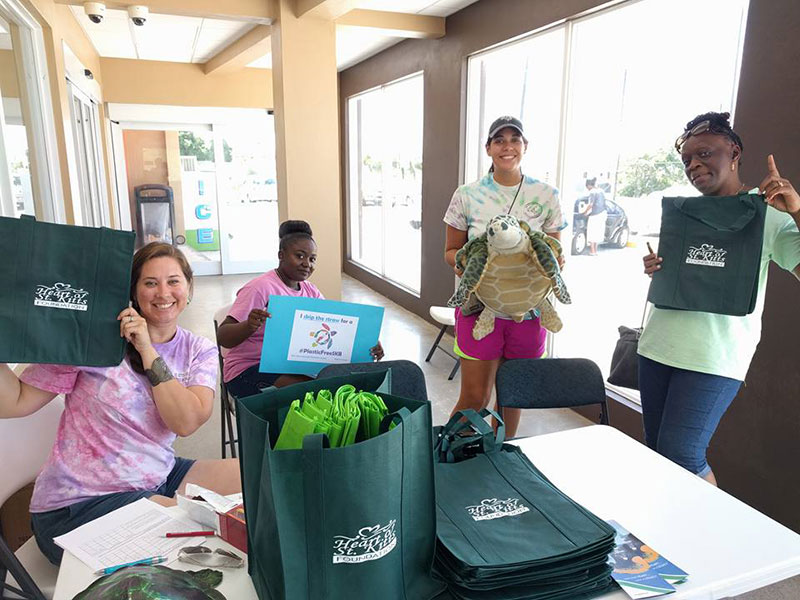 PART OF THE SOLUTION: SDC, St. Kitts Sea Turtle Monitoring Network, & Heart of St. Kitts representatives are all smiles at the reusable bag and outreach events during Plastic-Free July. Photo: Courtesy of SDC/Heart of St. Kitts Foundation