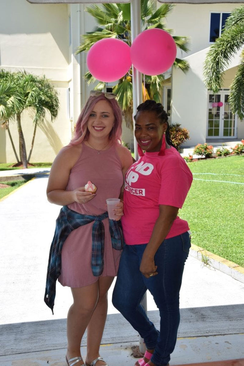 'PINK FRIDAY': UMHS student Ashley Oden & Alsha Daniel of the UMHS Bookstore at Pink Friday. Photo: Cecilia France/UMHS