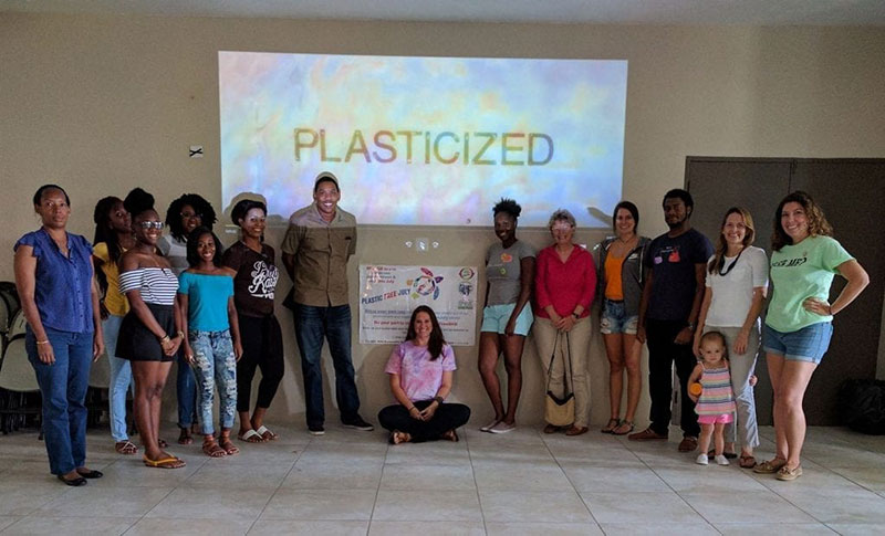 'PLASTICIZED': Supporters of Plastic-Free July attend a screening of the documentary 'Plasticized' in St. Kitts. Dr. Julie Graves of UMHS (in red blouse, second in righthand row) was interviewed for this post. Click here to see a brief video interview with Dr. Graves. Photo: Courtesy of SDC/Heart of St. Kitts Foundation