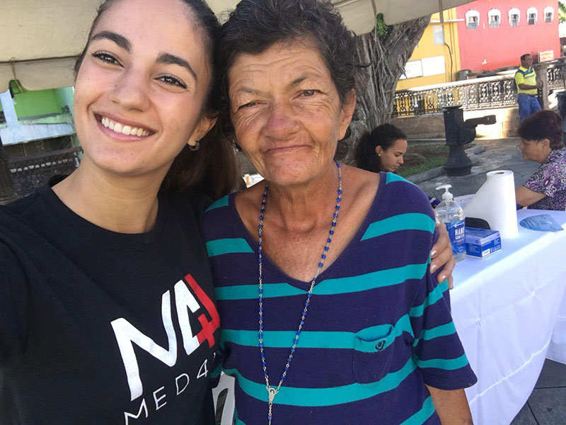 This patient (right) asked UMHS student & Med4You Vice President Paola Mora for a selfie because she wanted Paola to not forget how she helped her. Photo: UMHS Med4You