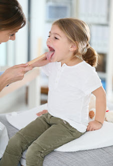 Pediatrician examining a child