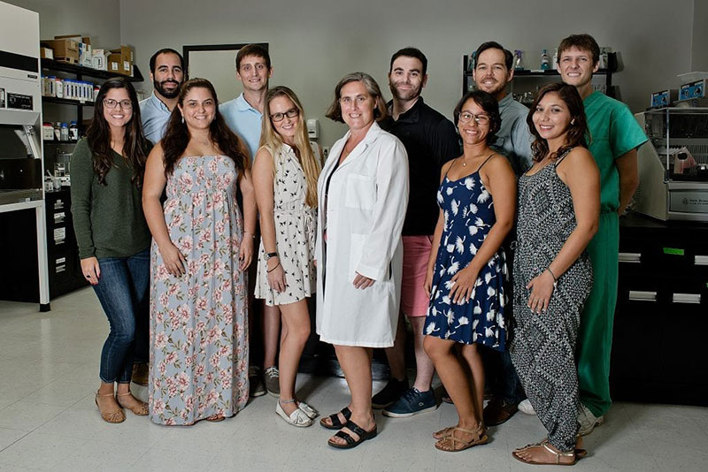 SECOND ANNUAL UMHS RESEARCH SYMPOSIUM: (Left to right): Lyanne Santana, Luis Acevedo, Jandrely Lope, James Thomas, Beani First, Dr. Jane Harrington, Steven Cook, Andrea Ferrer, Nick Mills, Idalis Sanchez. Photo: Ian Holyoak Photography