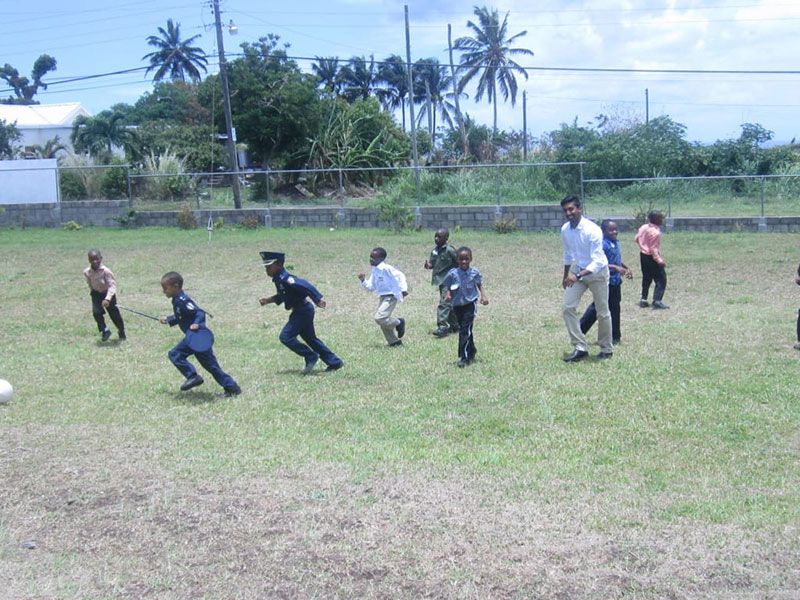 SOCCER GAME: The kids enjoyed playing soccer with UMHS student Andrew Victor. Photo: Ludny Charles