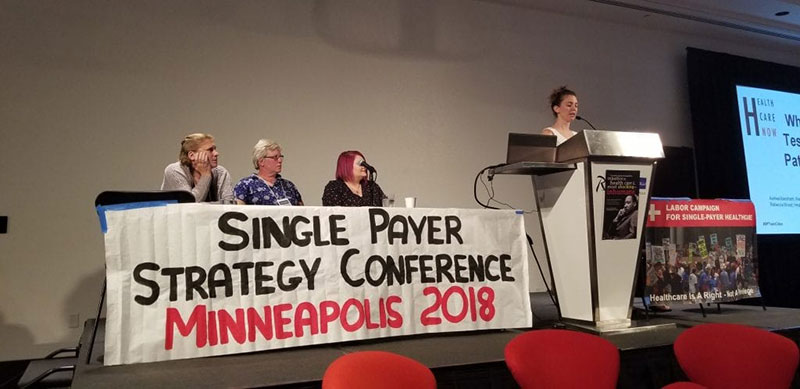 SINGLE-PAYER ADVOCATES AT STRATEGY CONFERENCE: Fans of ‘Medicare for All’ speak in Minneapolis in June 2018. Photo: Courtesy of Healthcare-NOW!