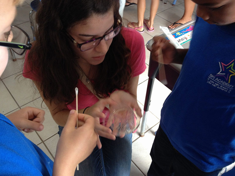 TEACHING KIDS AT SKI ACADEMY: UMHS student Laura Mena-Albors working with some future scientists. Photo: Ian Holyoak