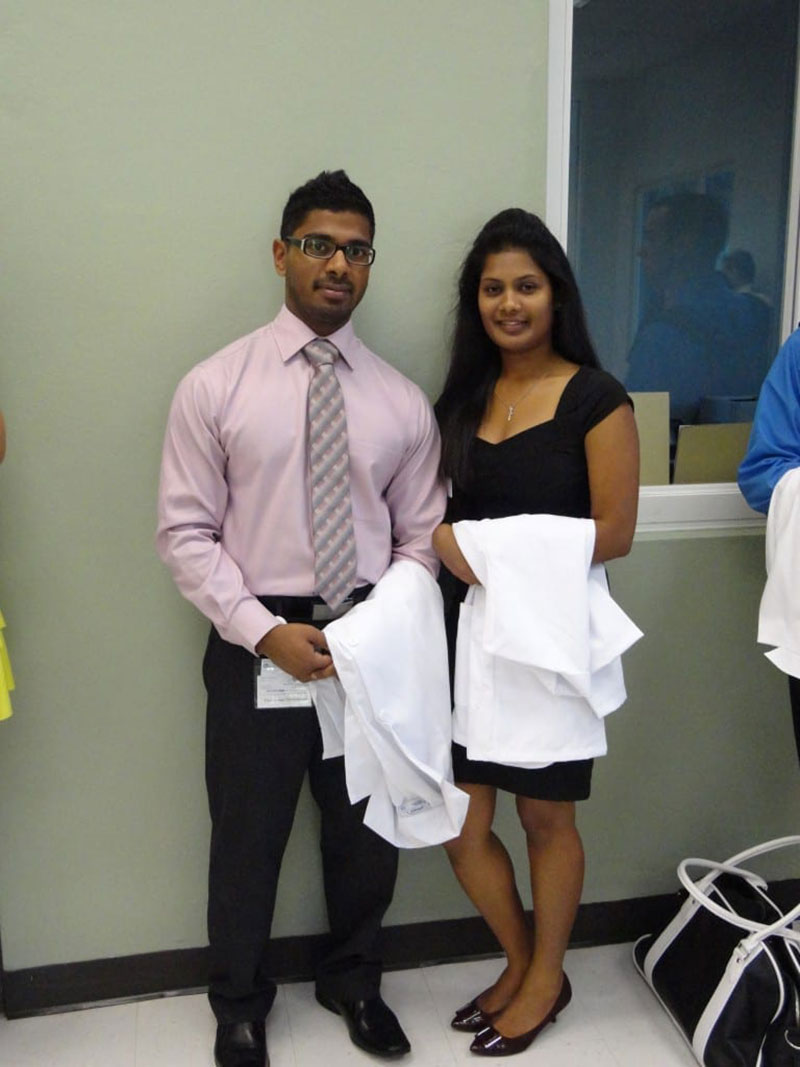 THUSHAN & THIVISA: 'At the library of UMHS, St. Kitts, lining up for the white coat ceremony & oath.' Photo: Courtesy of Dr. Thivisa Rajagopal