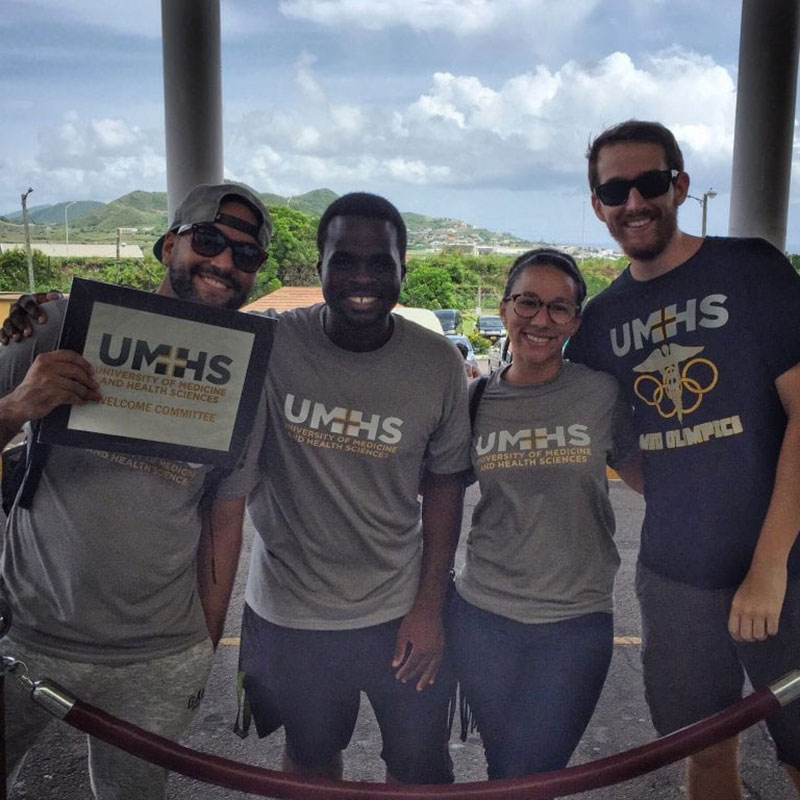 The smiling faces of the UMHS Welcome Committee members await students’ arrival at the airport in St. Kitts. Photo: Sean Powers