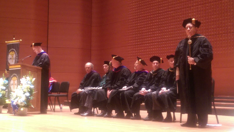 WELCOME ADDRESS BY DR. THORNTON: Jerry W. Thornton, Ph.D., Vice President of UMHS (at podium) addresses the Class of 2015. Far right: Dr. George H. Shade, Jr., UMHS Clinical Dean. Photo: Nelly Alvarez