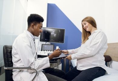 black-obgyn-doctor-with-patient