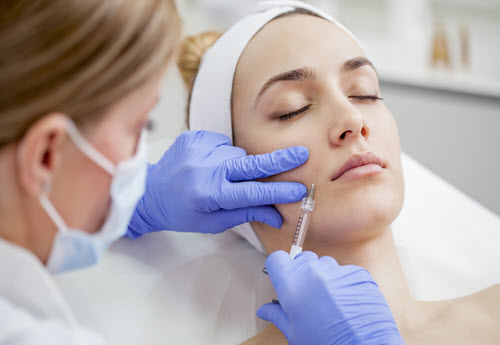 cosmetic dermatologist doing an injection