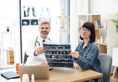 endocrinologist-showing-patient-results-of-ct-scan