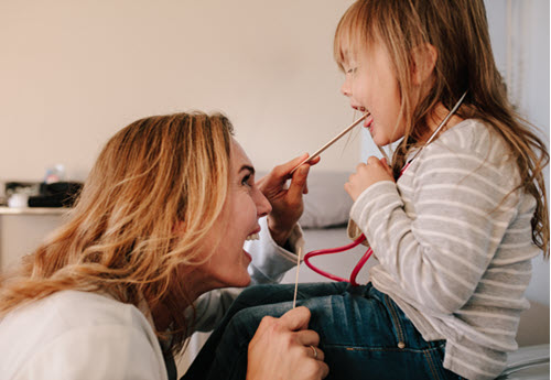 female childrens doctor with child