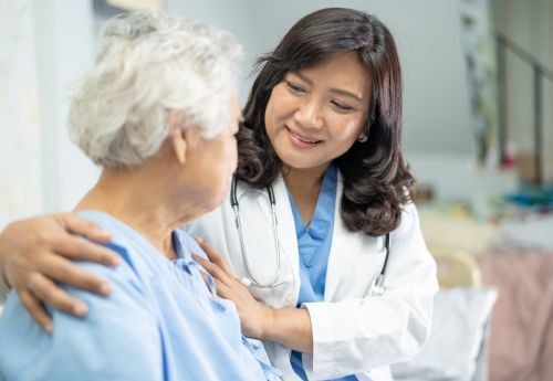 female-geriatrician-talking-to-a-patient