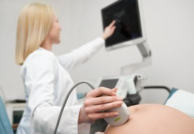 female-obgyn-performing-ultrasound-on-pregnant-woman