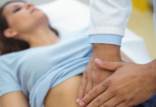 gastroenterology-doctor-palpating-a-patients-midsection