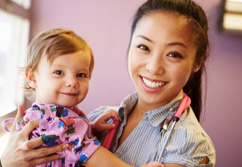 happy pediatrician with a child