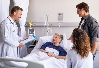 hospitalist-physician-with-patient-and-family