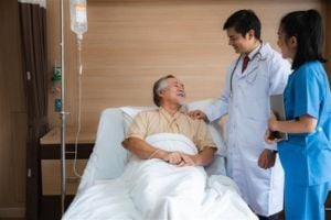 hospitalist-physician-with-patient-in-hospital