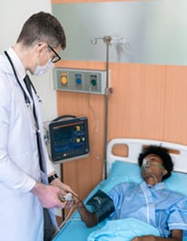 hospitalist-with-black-patient-in-bed