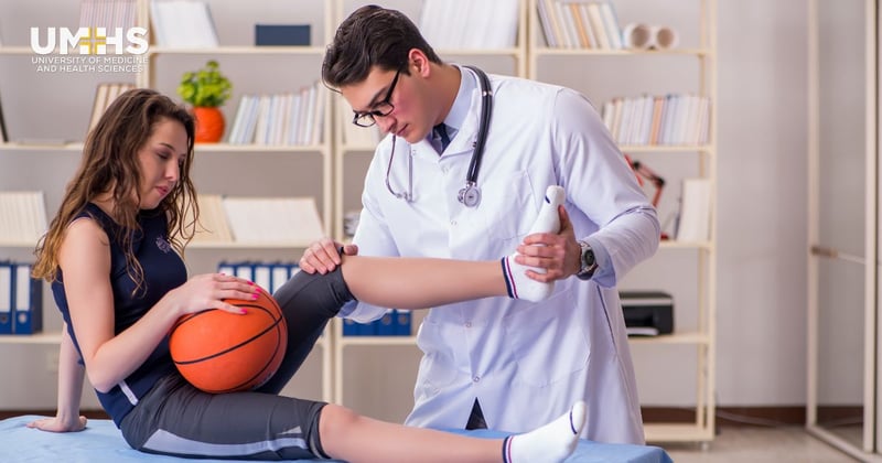 Sports medicine doctor with a female basketball player