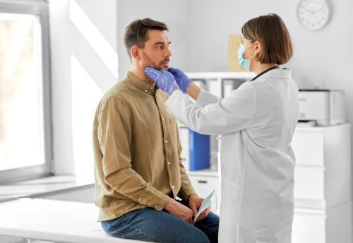 internal-med-doctor-palpating-submandicular-area