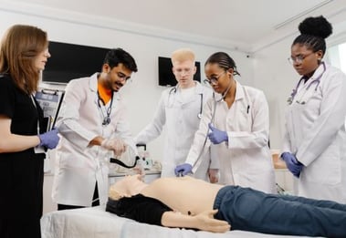 medical-students-practicing-with-dummy