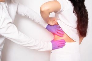 nephrologist-palpating-patients-side