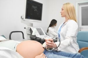 ob-gyn-performing-ultrasound-on-pregnant-women