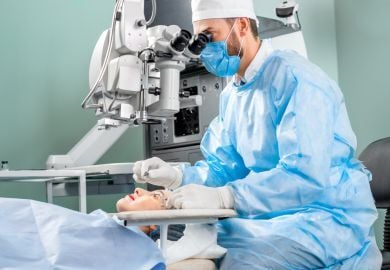 ophthalmologist-performing-surgery-on-left-eye
