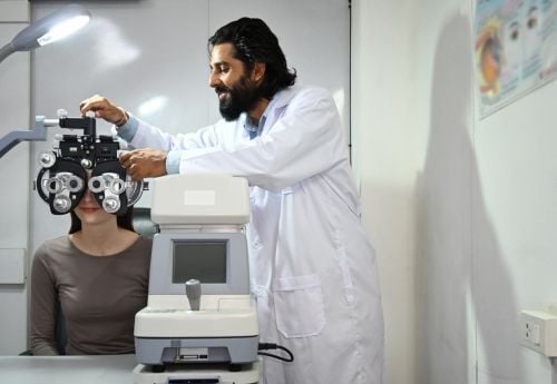 ophthalmologist-performing-vision-check